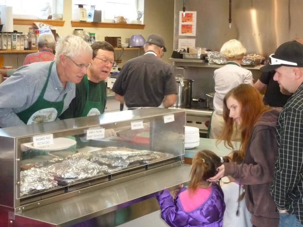 Contributed photos                                Scenes from previous Thanksgiving dinners.