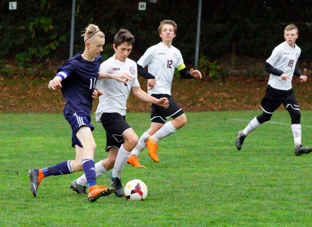 Contributed photo/Claudia Mills                                Boys soccer playoff game with Puget Sound Adventist Academy.