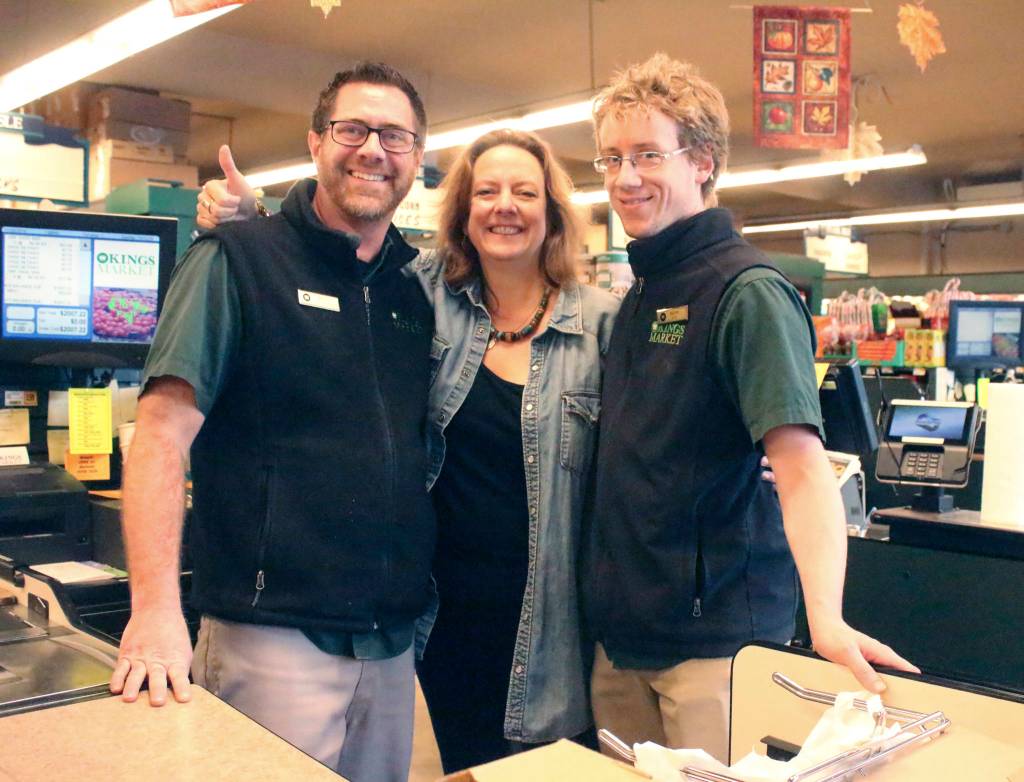 Staff photo/Heather Spaulding                                Staff photo/Heather Spaulding. Shahn McGuire with Kings Market employees, Taylor Clark and Frank.