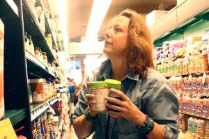 Staff photo/Heather Spaulding                                Staff photo/Heather Spaulding                                Shahn McGuire grabs items needed by the food bank.