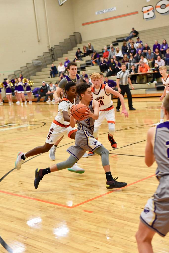 Contributed photo/John Stimpson                                Miles Williamson drives for the basket.