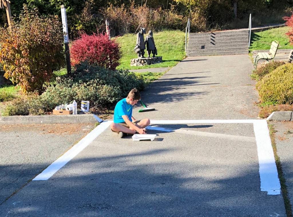 Contributed photo                                Charlie and Gavin repainted the elementary schools playground and crosswalk.