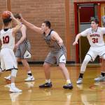 Contributed photo/John Stimpson                                Gavin Mason, on defense, shuts down the scoring opportunities for the Wolves.