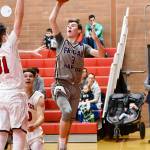 Contributed photo/John Stimpson                                Lucas Chevalier makes a jumper from the baseline for 2 more points.