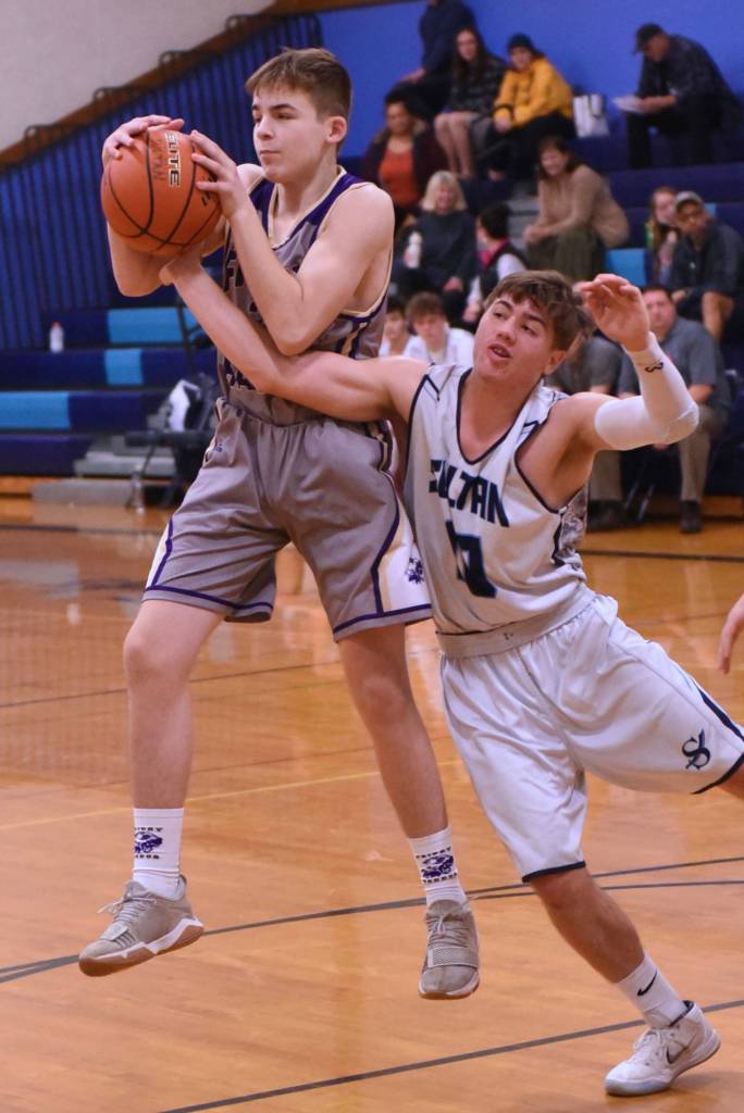 Contributed photo/John Stimpson                                Peter Kulseth grabs the rebound.