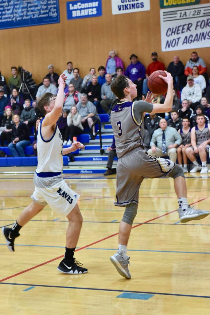 Contributed photo/John Stimpson                                Lucas Chevalier drives in for a 2-point layup.