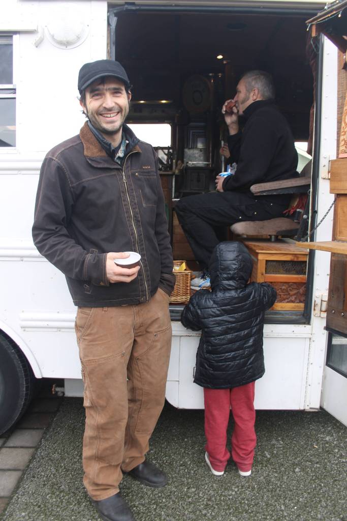Staff photo/Heather Spaulding                                Guisepi aka Joe, Spadafora, sips tea while talking with an island mom and her children.