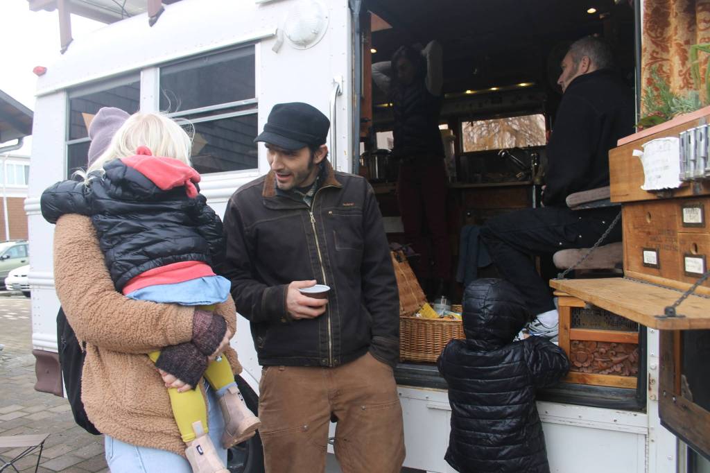 Staff photo/Heather Spaulding                                Guisepi aka Joe, Spadafora, sips tea while talking with an island mom and her children.