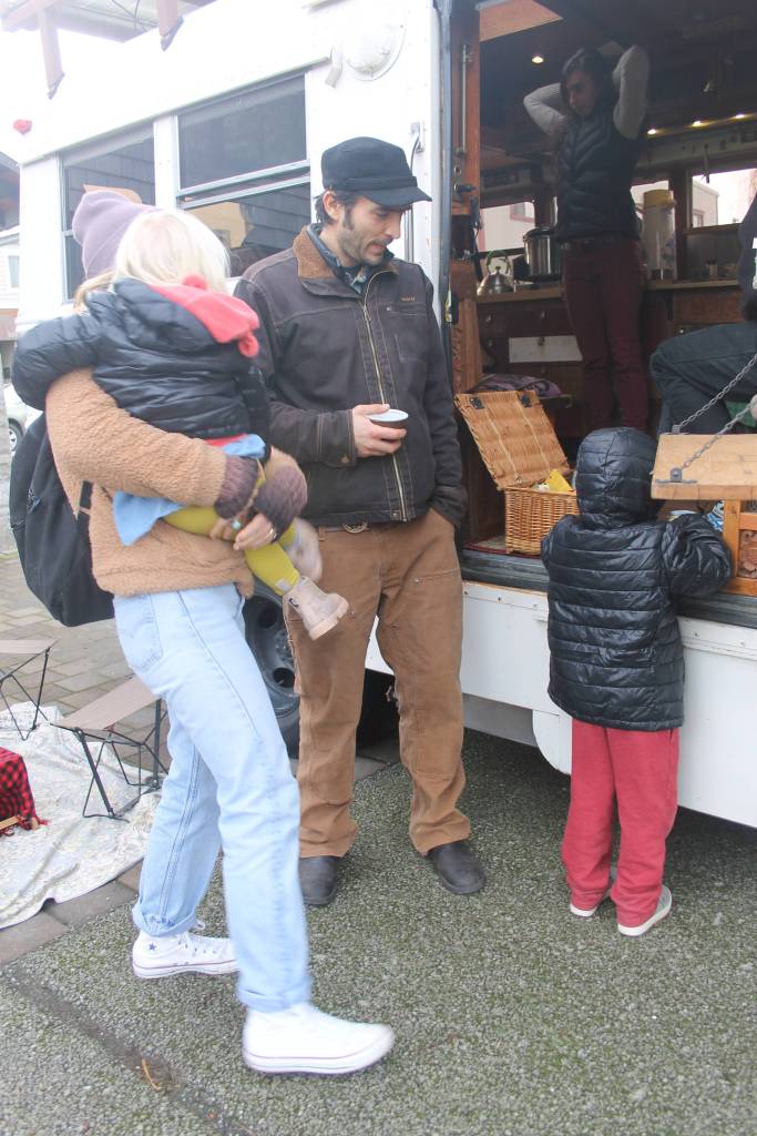 Staff photo/Heather Spaulding                                Guisepi aka Joe, Spadafora, sips tea while talking with an island mom and her children.