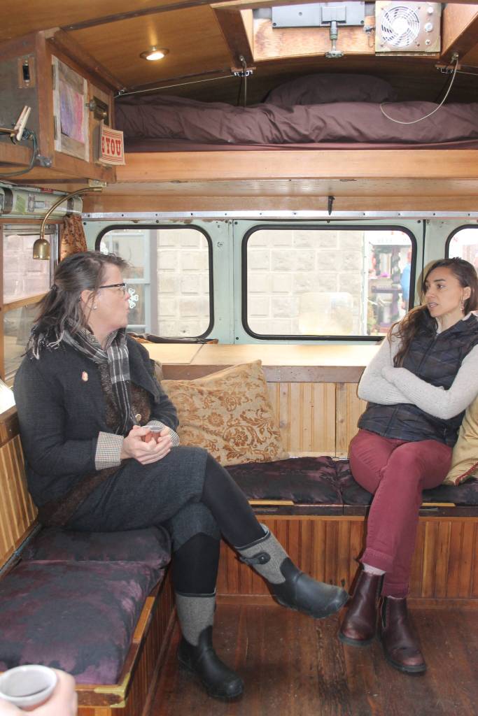 Staff photo/Heather Spaulding                                Inside the bus Ally Rugge engages with the public.