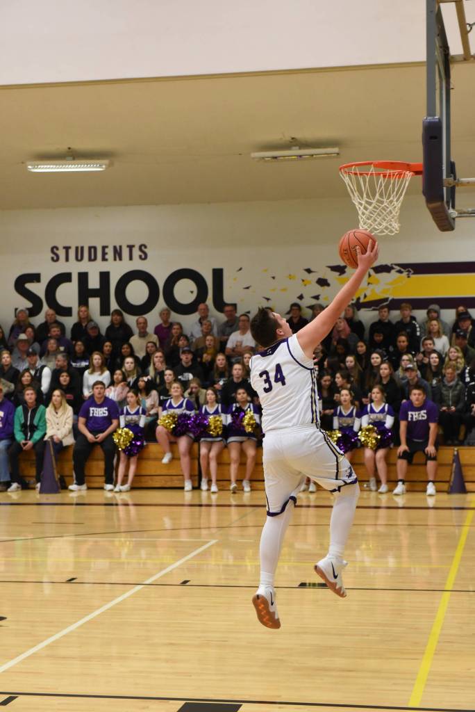 Contributed photo/John Stimpson                                Gavin Mason on the fast break and 2-point layup.