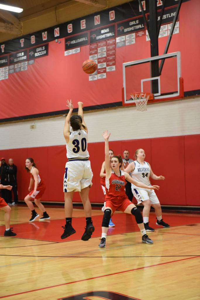 Contributed photo/John Stimpson                                Alex Holman releases the ball towards the basket.