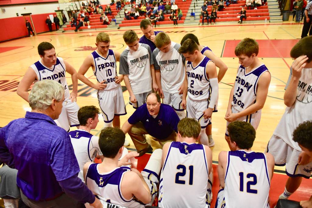 Contributed photo/John Stimpson                                Boys head coach Rod Turnbull discusses strategy with the players.