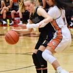 Contributed photo/John Stimpson                                Darcy Ayers maintains her cool under tight pressure from the defense.