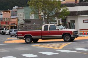 Staff photo/Hayley Day                                A driver makes his way through Friday Harbors painted roundabout after it first opened in May.