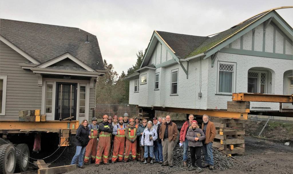 Contributed photo/San Juan Community Home Trust                                The Nickel Brothers crew and onlookers stand in front of the new home trust houses on San Juan.