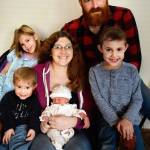 Staff photo/Tate Thompson. From top left to bottom right, the Wilson family: Kyra, Kyle, Quin, Melanie holding Rosaia, and Liam.