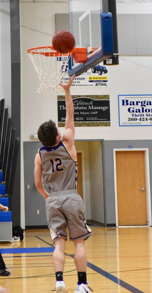 Contributed photo/ John Stimpson                                Ethan Germain glides in for an easy two-point layup.