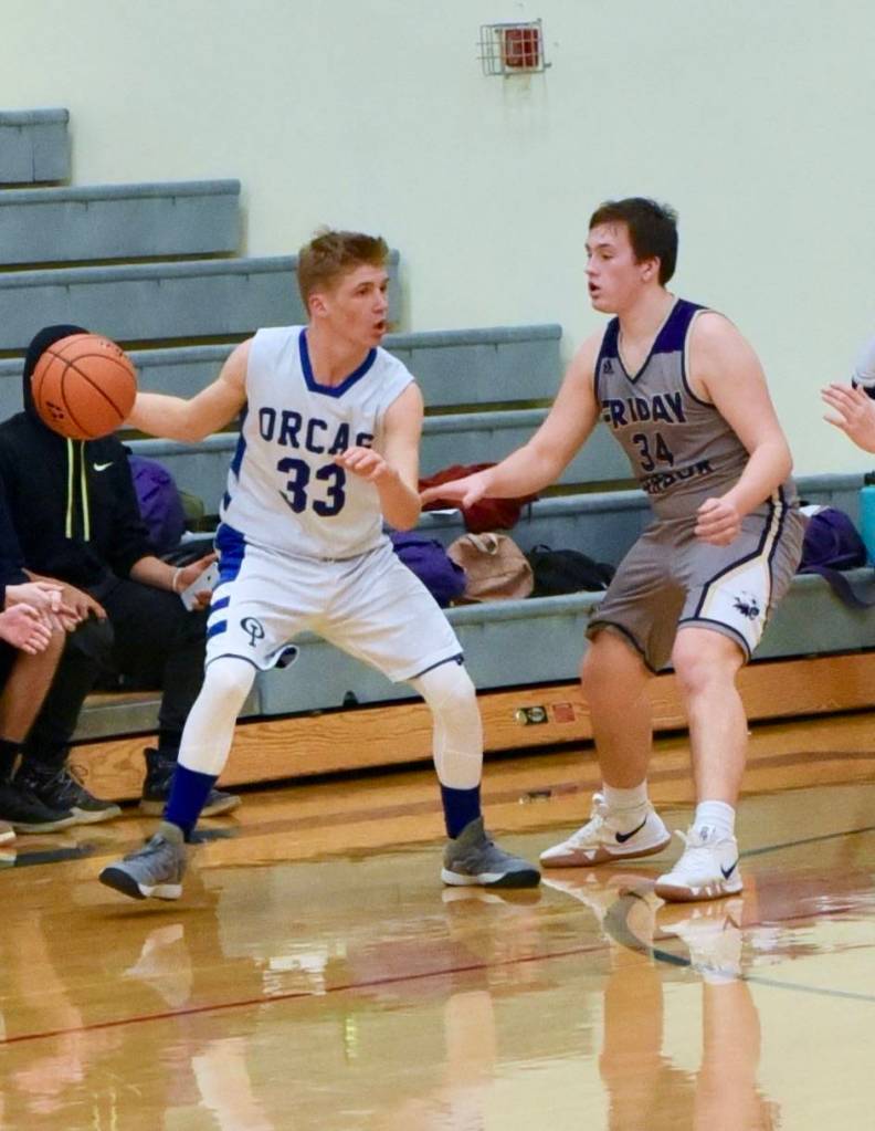 Gavin Mason hinders his man from going to the basket.