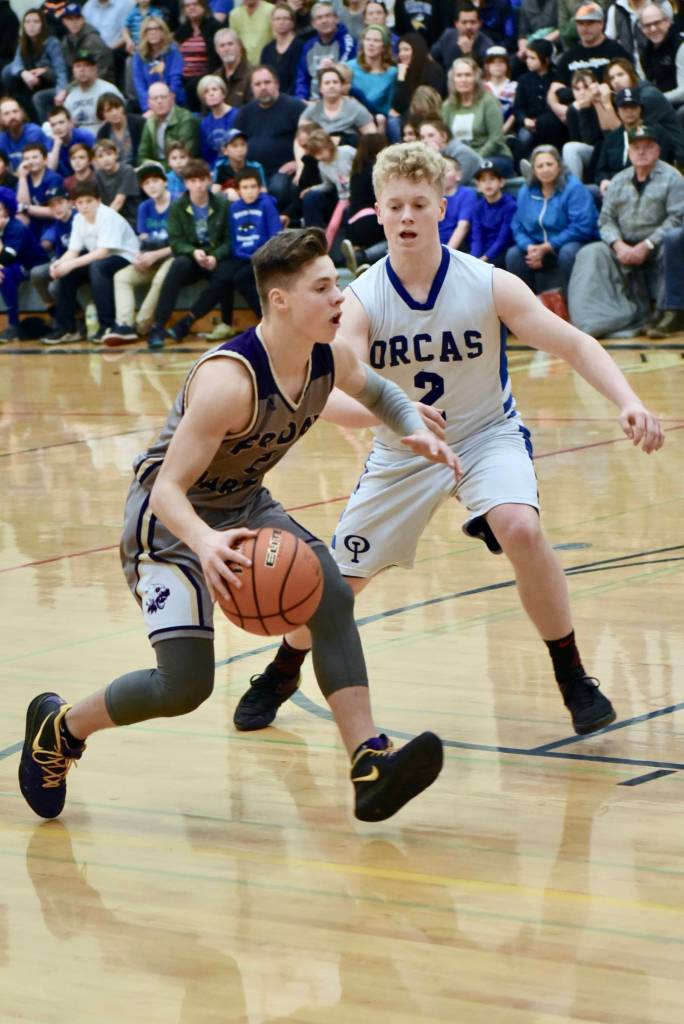 Kyson Jackson starts a drive toward the basket.