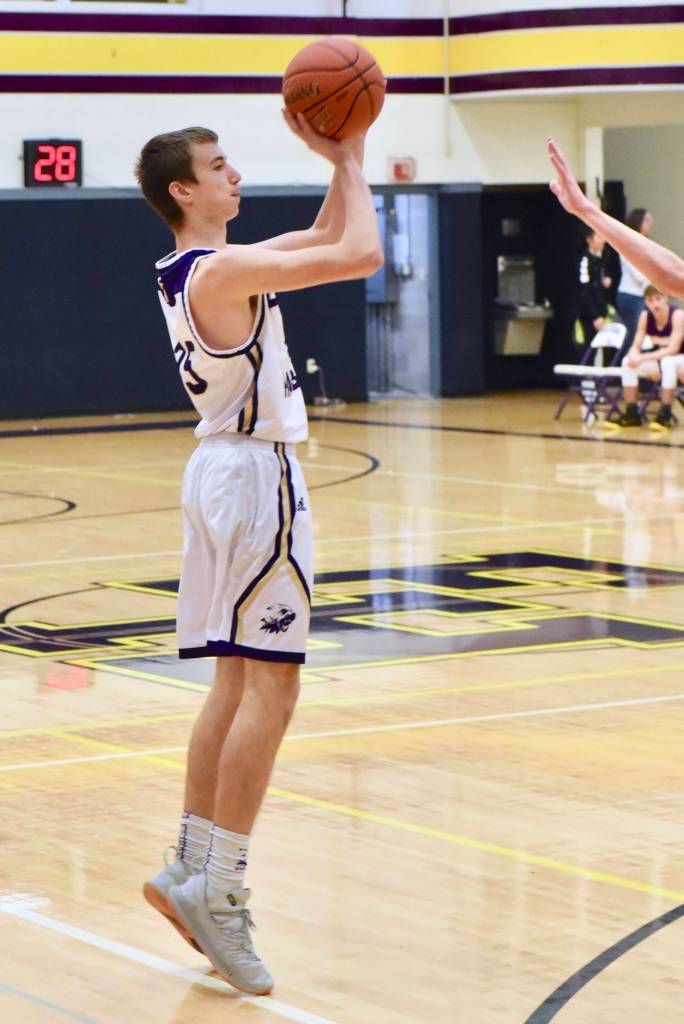 Kenny Hallock shoots for a 3-point basket.
