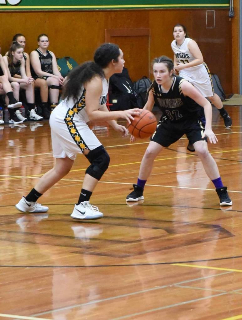 Fallon Taylor applies defensive pressure to the Logger. / John Stimpson photo