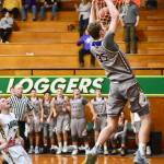 Marshall Clark reignites the crowd and the Wolverine bench with his rim grabbing slam dunk. / John Stimpson photo