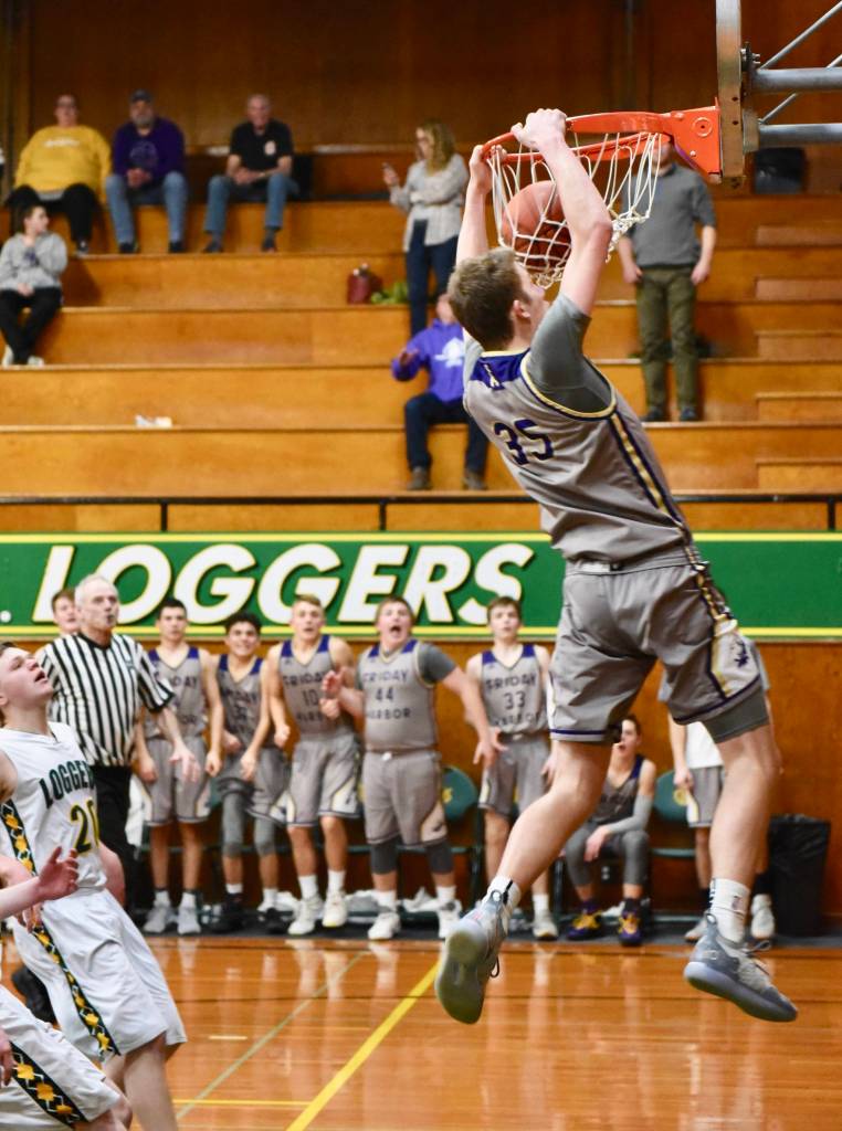 Marshall Clark reignites the crowd and the Wolverine bench with his rim grabbing slam dunk. / John Stimpson photo