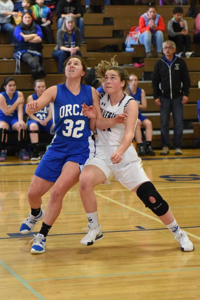 John Stimpson photo / Bailee Lambright battles for rebound position.