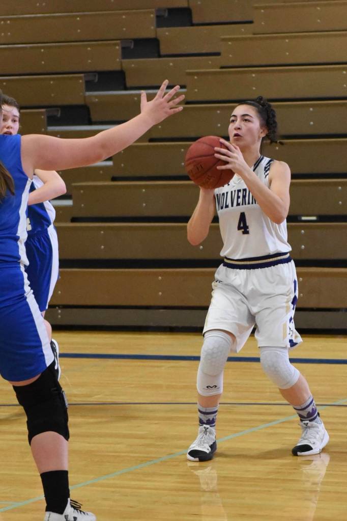 John Stimpson photo / Ava Hoffman from the side line shoots for two points.