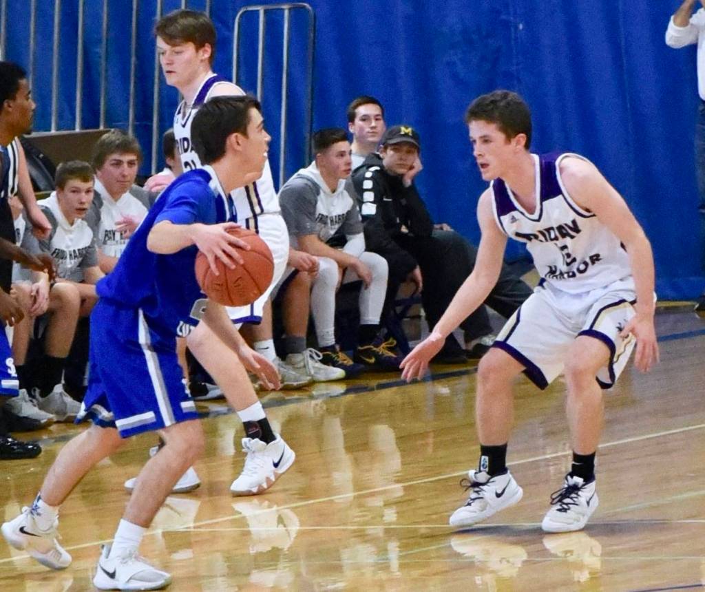 John Stimpson photo / Ethan Germain applies tight defensive pressure.