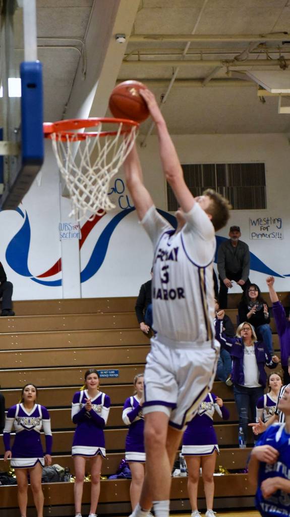 John Stimpson photo / Marshall Clark ignites the crowd with a slam dunk.