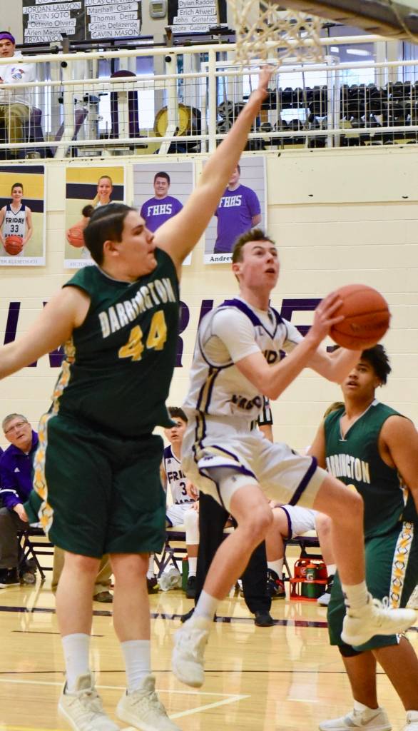 John Stimpson photo / Lucas Chevalier drives underneath toward the basket.