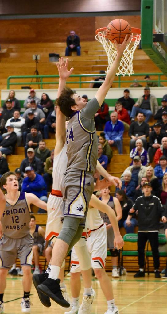 John Stimpson photo / Kyle Mapstead out jumps the defender for two points.