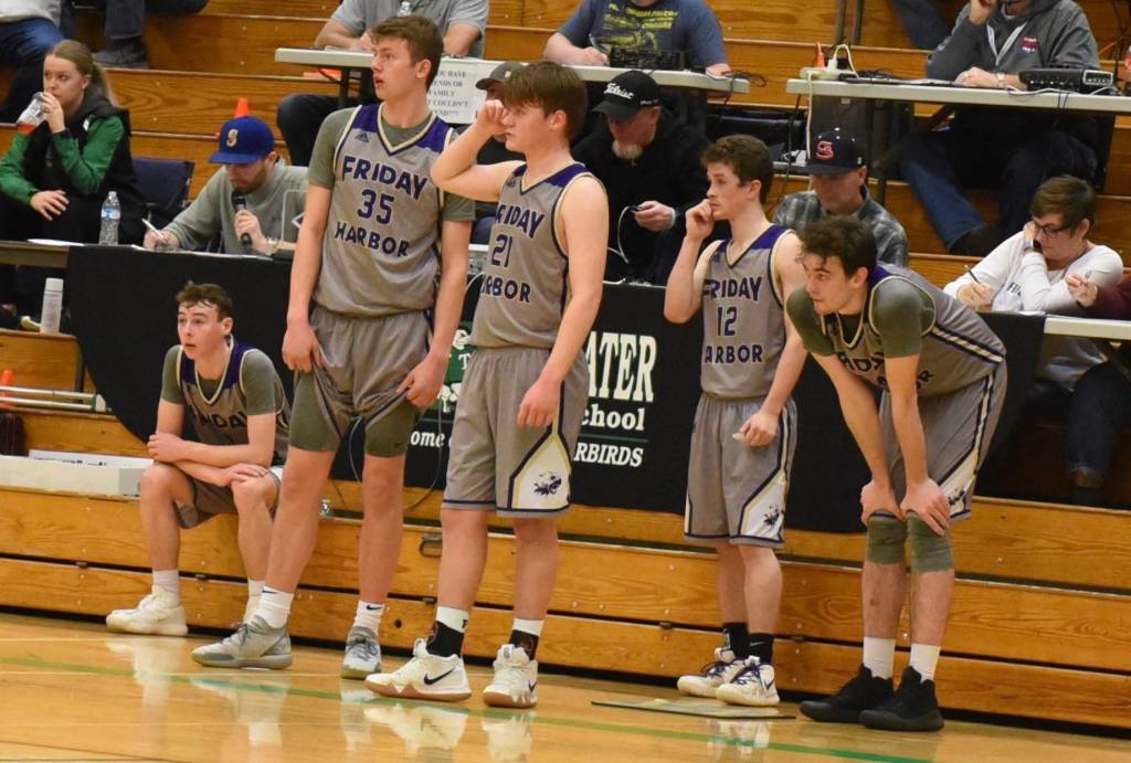 John Stimpson photo / The starting five watch their hopes for the playoffs slip by.