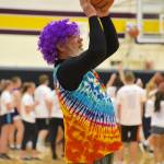 High school staff battle seniors on the court