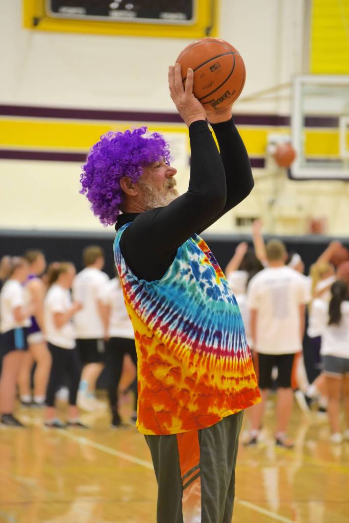 High school staff battle seniors on the court