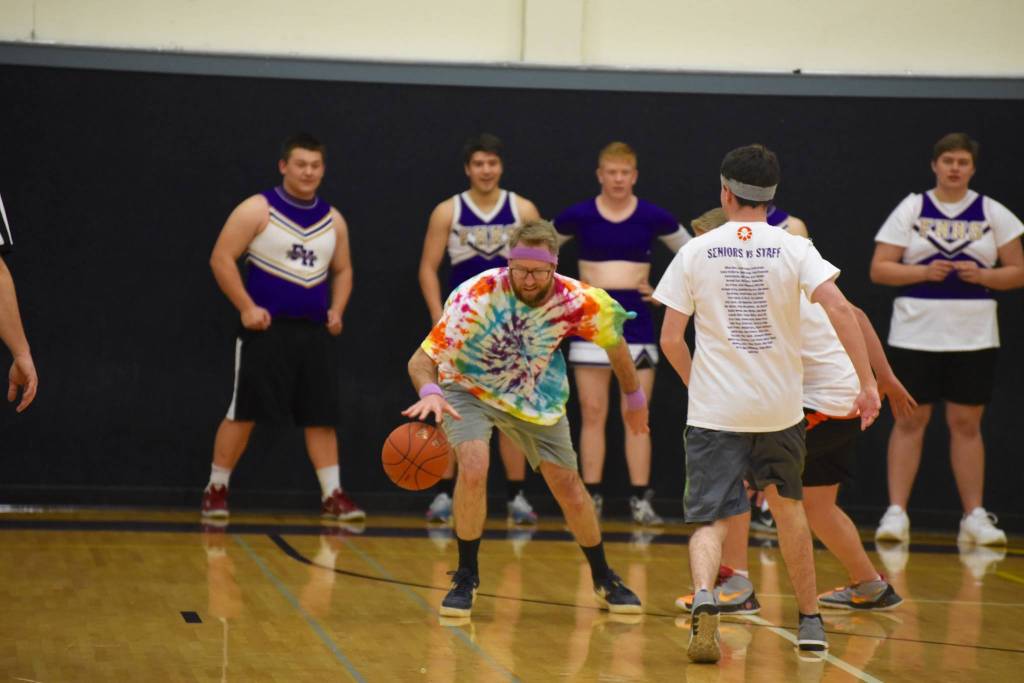 High school staff battle seniors on the court