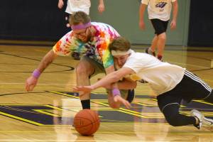 High school staff battle seniors on the court
