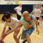 High school staff battle seniors on the court