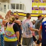 High school staff battle seniors on the court
