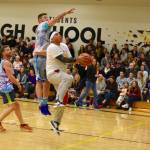 High school staff battle seniors on the court