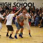 High school staff battle seniors on the court