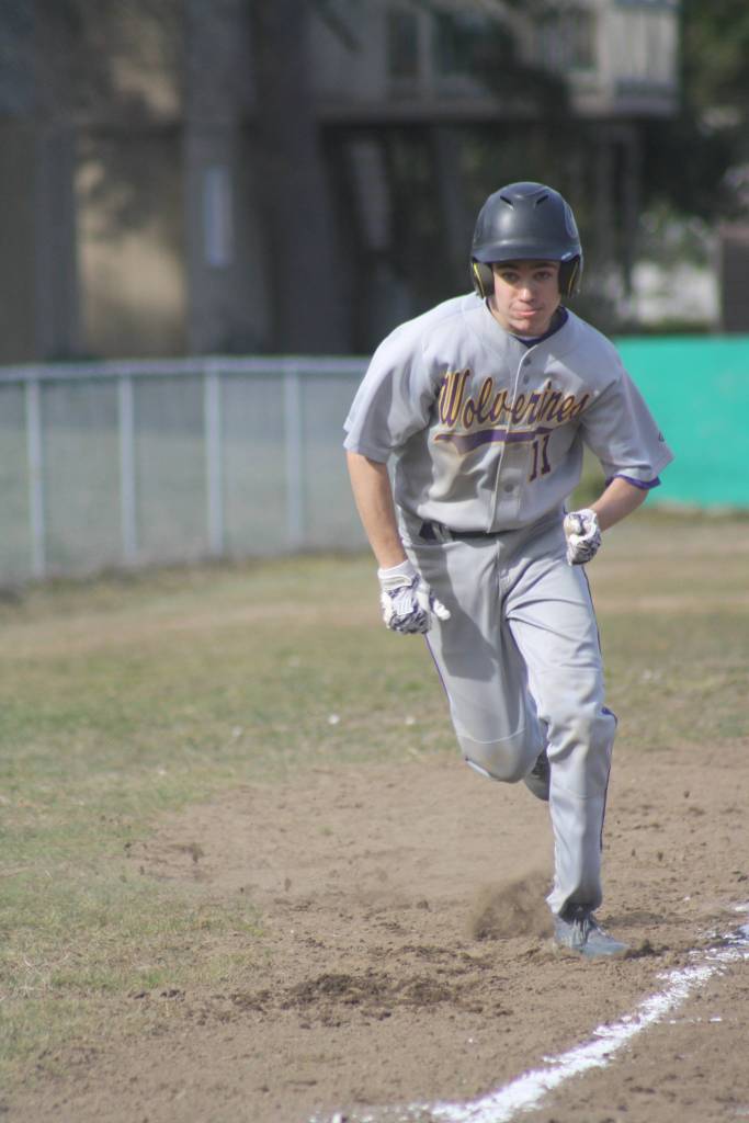 Staff photo/Heather Spaulding. Ty Anderson runs home.