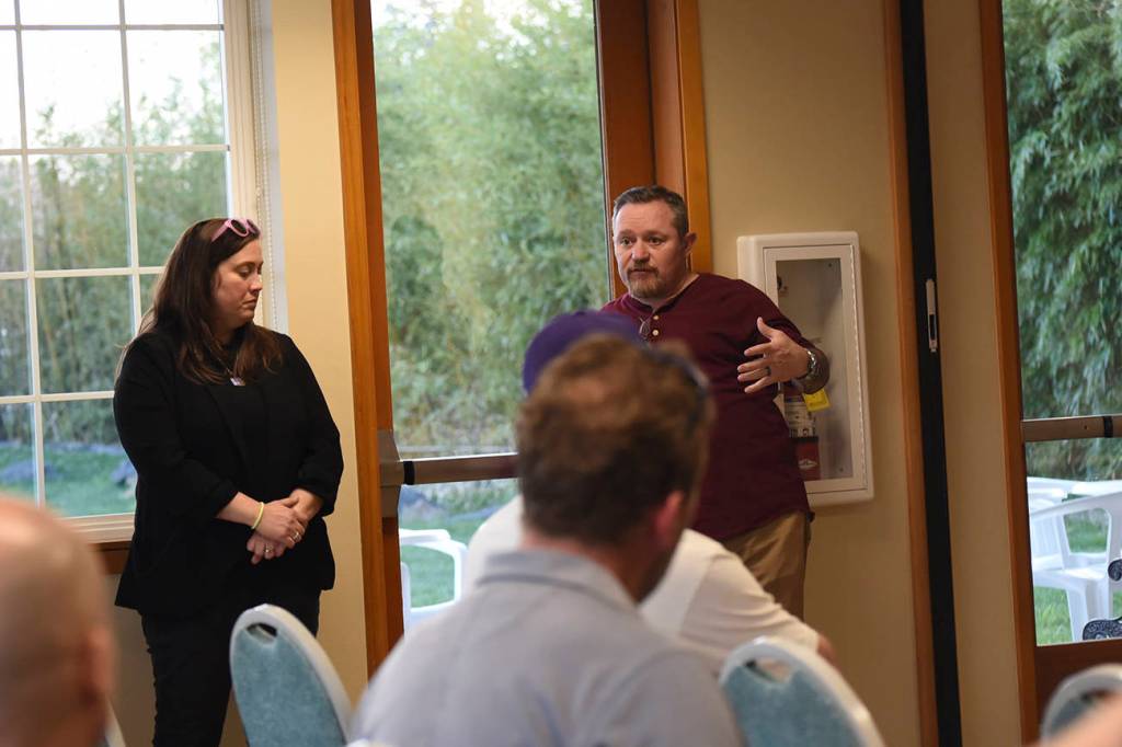 Staff photo/Tate Thomson                                Linnea Anderson and Carl Marino answer questions from meeting attendees.