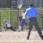 Staff photo/Tate Thomson                                Pitcher Grace Pauls throws ball to Jayna Ott on first.
