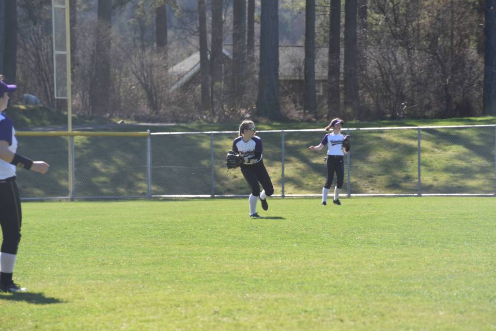 Staff photo/Tate Thomson                                Pitcher Grace Pauls throws ball to Jayna Ott on first.