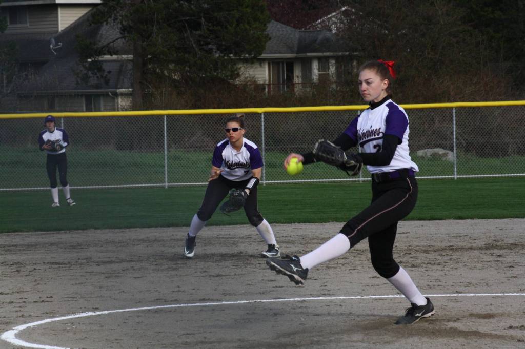 Staff photo/Heather Spaulding. Thea Seitz on third and ready to score.                                Staff photo/Heather Spaulding. Pitcher Marcella Kirkland on the mound, behind her, Bristol Halvorson as shortstop.