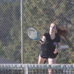 Staff photo/Heather Spaulding. Katy Kulseth finishes a serve.