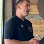 Commander Tyler LeRoy accepting Fin Award. Staff photo/Heather Spaulding.